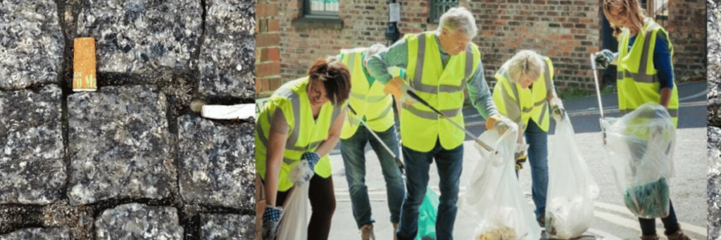 On the right in the picture are people in high-visibility vests picking up garbage with grabbing arms and garbage bags.
On the left, a paving stone with cigarette butts stuck in the gaps.   