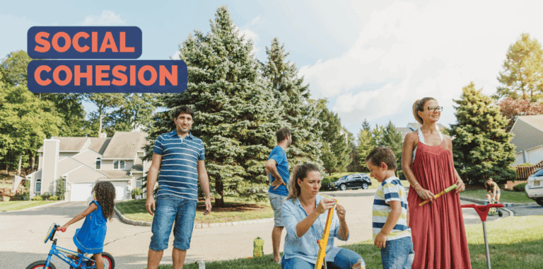 Family standing in a residential area playing with their children
