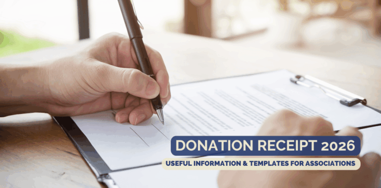 Hand signs a document at the desk with a black ballpoint pen.