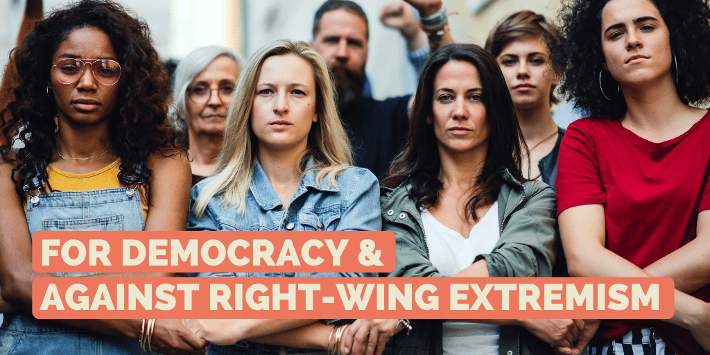 Group of people standing resolutely together hand in hand and looking into the camera