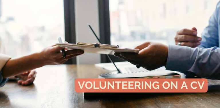 A person hands a CV to another person.